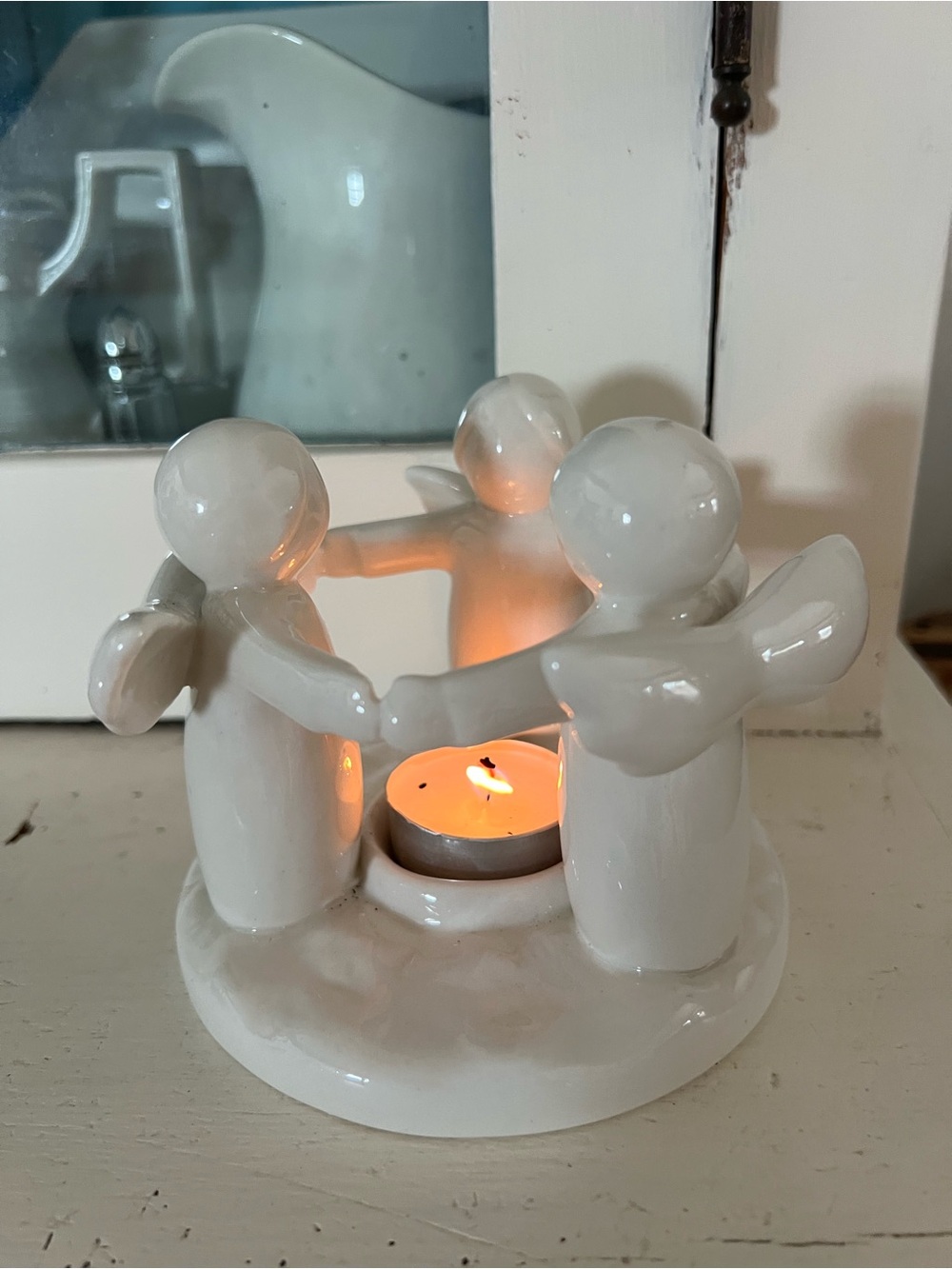 CIRCLE OF ANGELS STONEWARE
TEALIGHT CANDLE HOLDER